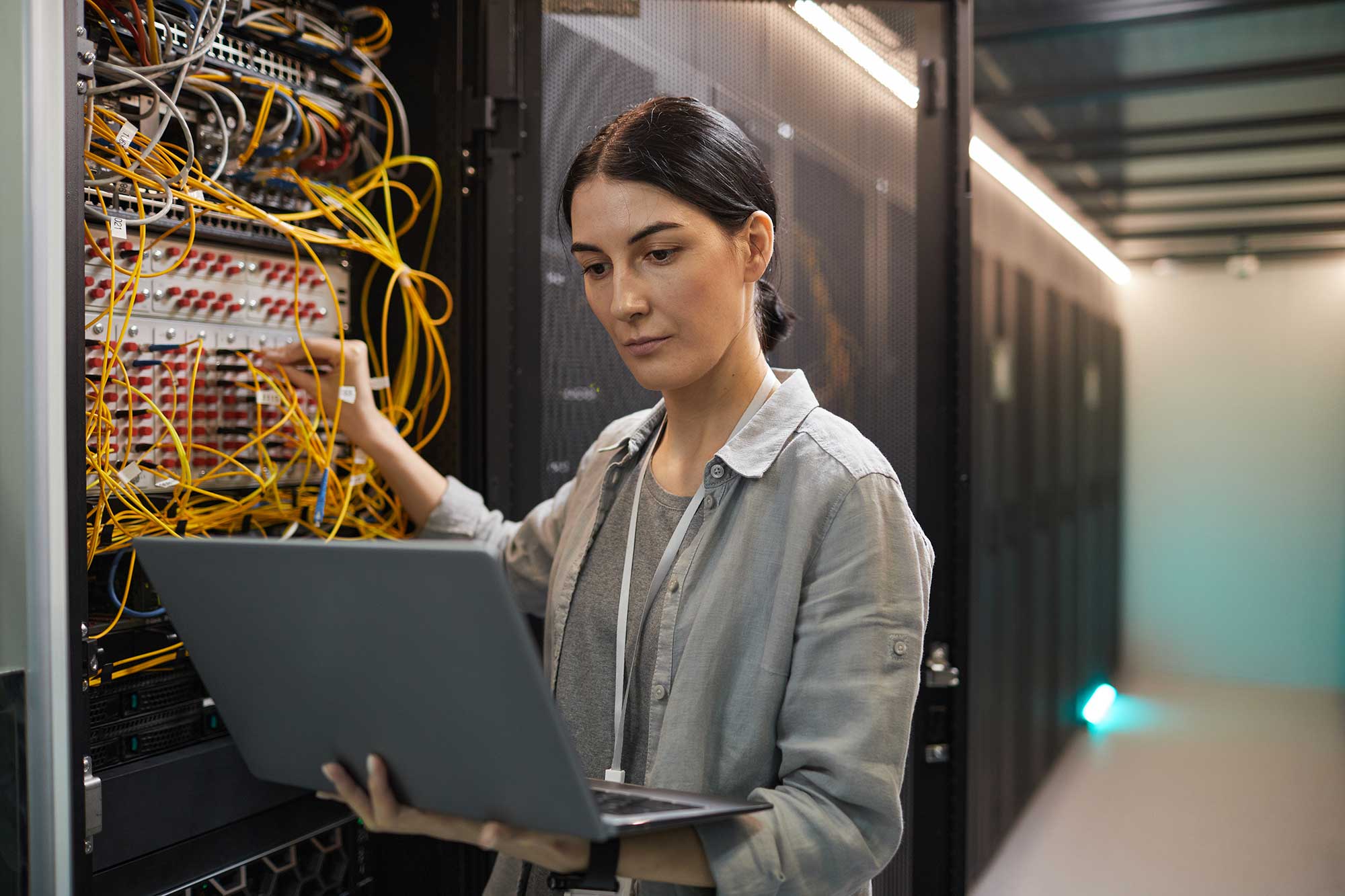 female-network-technician-inspecting-servers-in-da-2022-02-01-22-36-30-utc